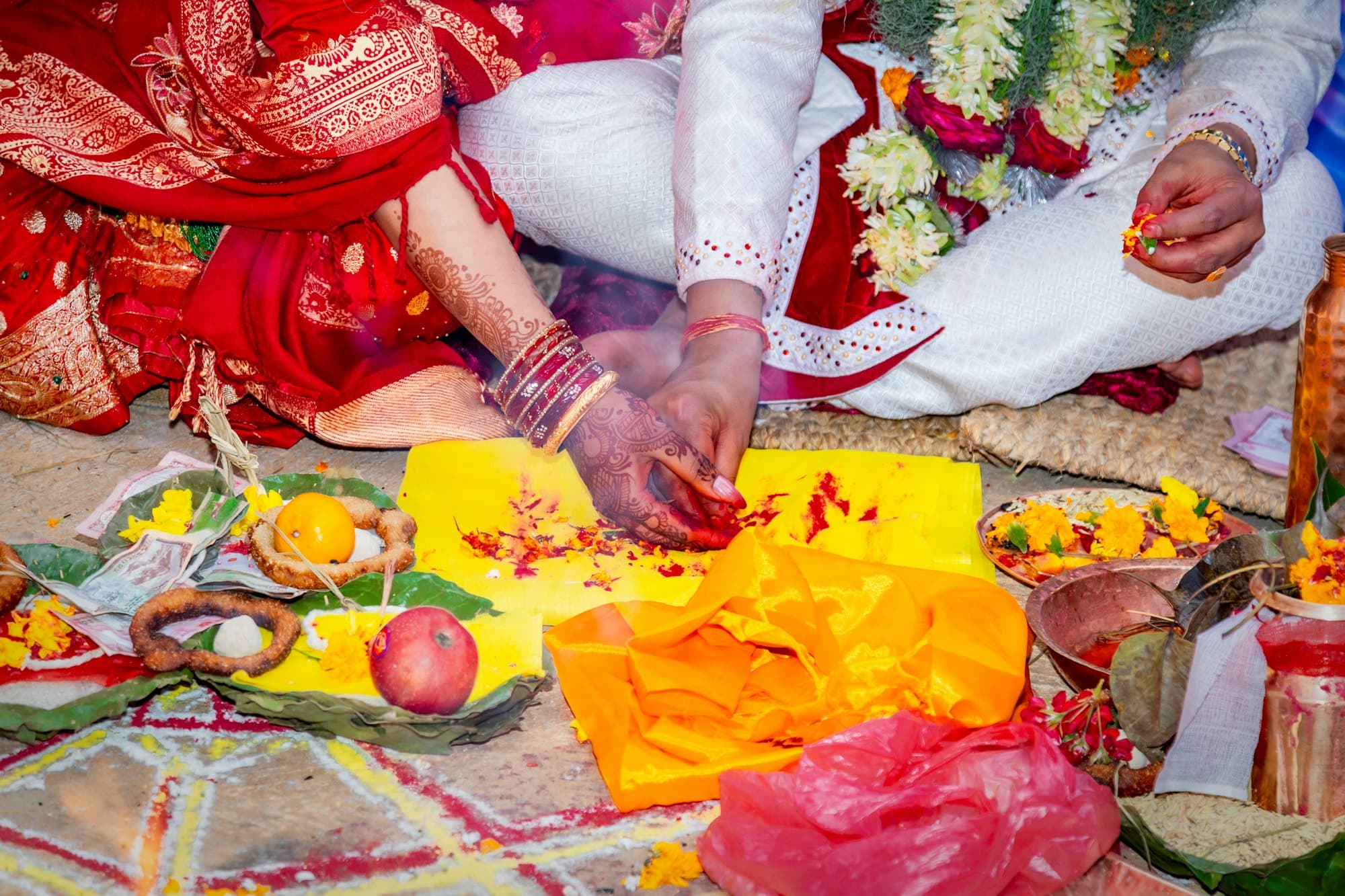 A couple performing a traditional Indian wedding ritual